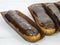 Gorgeous extra chocolate eclairs with gilded glaze