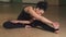Gorgeous flexible woman stretching her body doing yoga