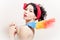 Gorgeous funny pinup woman removing dust