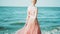 Gorgeous girl in long light pink shiny dress left alone on the island, near large blue ocean, holds her hand behind her