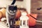 Gorgeous grey cat standing on a table with Halloween themed decorations.