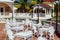 Gorgeous inviting view of Memories resort landscape, outdoor cafe, patio with metal vintage retro classic chairs at early morning