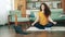 Gorgeous lady is meditating at home during self-isolation