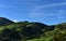 Gorgeous Lush Green Fields on Hills with Blue Skies