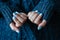 Gorgeous manicure, pastel tender blue color nail polish, closeup. Female hands over simple background