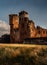 Gorgeous moody shot of the corner portion and surrounding wall of Penrith Castle at sunset in Cumbria, England