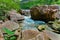 Gorgeous natural landscape view of Niagara Falls escarpment rushing river with big rocks and stones background