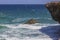 Gorgeous nature landscape view. Rocky coast washed by Caribbean sea waves.