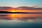 Gorgeous orange teal sunset on huge calm lake