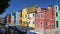 Gorgeous panorama of beautiful colorful houses in Burano, Venice canal