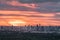 Gorgeous panorama scenic of the sunrise with cloud on the orange sky over large metropolitan city in Bangkok
