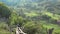 Gorgeous rustic mountain landscape, wooden fence on spring green nature