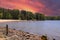 A gorgeous sandy beach on the banks of the rippling lake at sunset with powerful clouds at Dallas Landing Park
