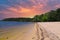 A gorgeous sandy beach on the banks of the rippling lake at sunset with powerful clouds at Dallas Landing Park