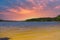 A gorgeous sandy beach on the banks of the rippling lake at sunset with powerful clouds at Dallas Landing Park