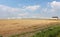 Gorgeous scene of plowed fields and greenhouses