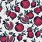 Gorgeous seamless pattern with cut and whole pomegranates growing on branch with green leaves. Delicious fresh fruits