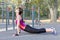 Gorgeous slim young woman practices yoga at outdoor sportsground. Cobra asana. Calmness and relax, stretching. Real woman morning
