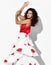 Gorgeous smiling woman hispanic dancer wearing red white gown with flower print dances Carmen flamenco holding hands up