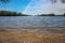 a gorgeous spring landscape at Lanier Point Park with rippling blue water surrounded by lush green trees and plants