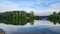 a gorgeous spring landscape at Proctor Landing Park at sunset with rippling water surrounded by lush green trees and plants