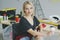 Gorgeous stylish woman sitting at workbench