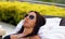 Gorgeous successful playboy model relaxing at pool in hotel resort in Costa Rica
