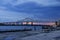 a gorgeous summer landscape along the Mississippi River with the Crescent City Connection bridge over the water with blue sky