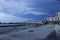 a gorgeous summer landscape along the Mississippi River with the Crescent City Connection bridge over the water with blue sky