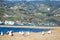 A gorgeous summer landscape at the Malibu Lagoon with brown and white seagull in flight and brown and black seagulls standing