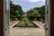 a gorgeous summer landscape at New Orleans Botanical Garden with a pond covered in lily pads and colorful water lilies, lush green