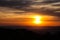 Gorgeous sunset with brilliant clouds on the orange sky