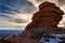Gorgeous sunset on a rock formation in Canyonlands National Park in the winter with snow in Moab Utah