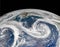 Gorgeous swirling clouds make a striking first impression in Gulf of Alaska image as seen from the space.