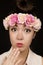 Gorgeous teen girl wearing floral crown surprised expression