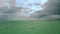 Gorgeous tropical landscape view, Maldives. Turquoise water of Indian Ocean and amazing white clouds.