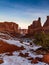 Gorgeous vertical sunrise shot of `Park Avenue` in Arches National Park in the winter with snow in Moab, Utah