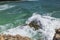 Gorgeous view of big turquoise waves of Atlantic ocean crashing on rocks of island of Aruba..