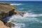 Gorgeous view of big turquoise waves of Atlantic Ocean rolling on rocky coast of island of Aruba.