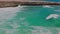 Gorgeous view of big turquoise waves Caribbean sea on rocky coast of island of Aruba.