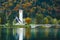 Gorgeous view of colorful autumnal scene of famous Church of St John the Baptist, Bohinj Lake, Ribicev Laz, touristic village in S