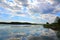 Gorgeous view of natural landscape on a summer day. Lake and blue sky converging on the horizon.