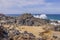 Gorgeous view of rocky coast washed by Caribbean sea waves.