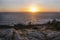 Gorgeous view of the sea with dramatic sunset, seen from a lovely and rocky viewpoint in Cabo Mondego, in Portugal