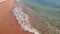 Gorgeous view of sea rolling waves rolling on coast of sandy beach.