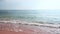 Gorgeous view of sea rolling waves rolling on coast of sandy beach in Mediterranean sea.