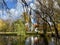 Gorgeous view of the Sigulda Evangelical Lutheran Church in Latvia with colorful trees around a pond