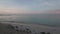 Gorgeous view of sunrise on Atlantic Ocean on Aruba island. White sandy coast and turquoise water surface merging with blue sky.