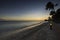 Gorgeous view of sunset in Atlantic ocean with setting sun beyond horizon on island of Aruba.