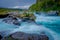 Gorgeous view of water passing through volcanic rock creating waterfalls, formed by an eruption of volcano Osorno in the